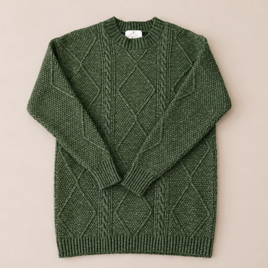 A dark green cable-knit crewneck sweater with a diamond pattern, laid flat on a light beige background.