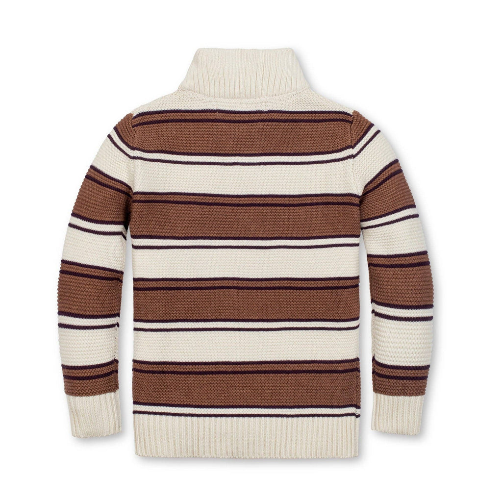 A striped knit turtleneck sweater shown from the back, featuring horizontal stripes in brown, cream, and thin dark navy lines on a plain white background.
