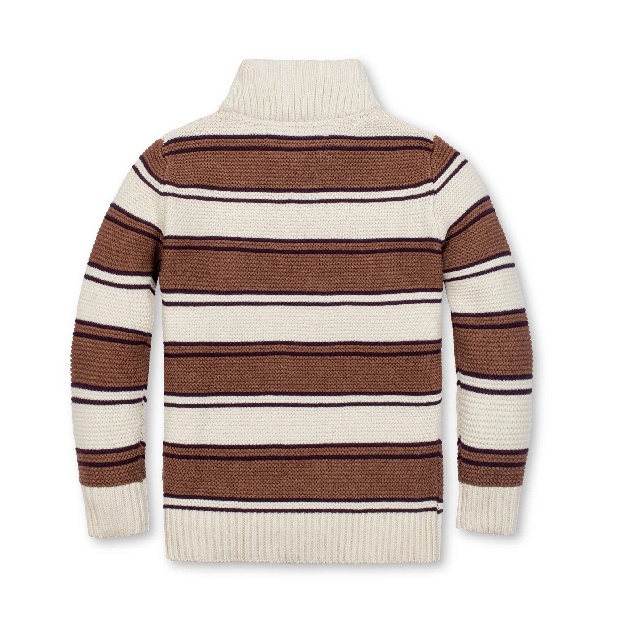 A striped knit turtleneck sweater shown from the back, featuring horizontal stripes in brown, cream, and thin dark navy lines on a plain white background.