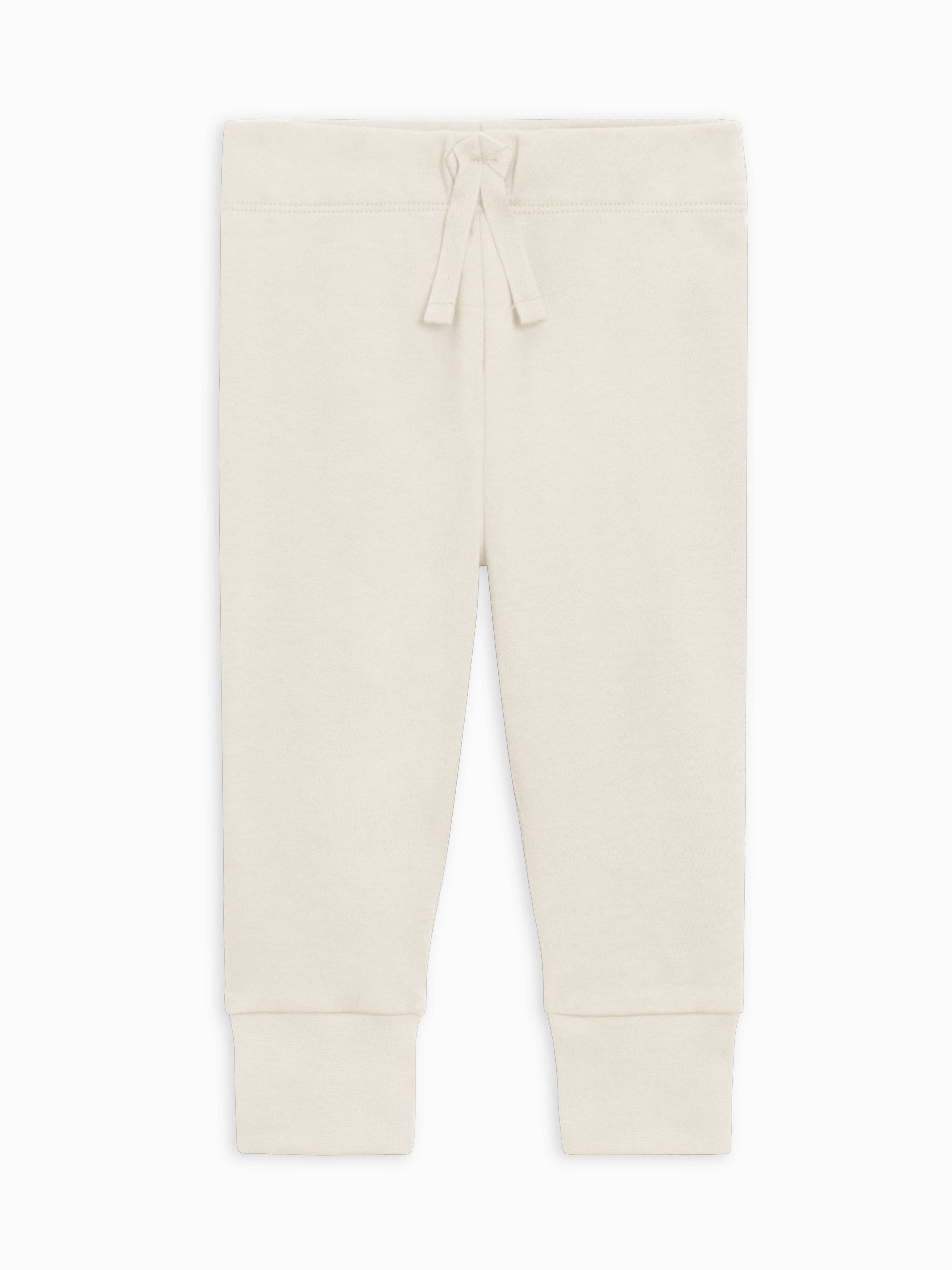 Beige jogger pants on a white background