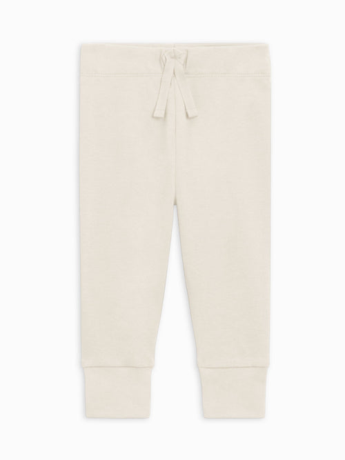 Beige jogger pants on a white background
