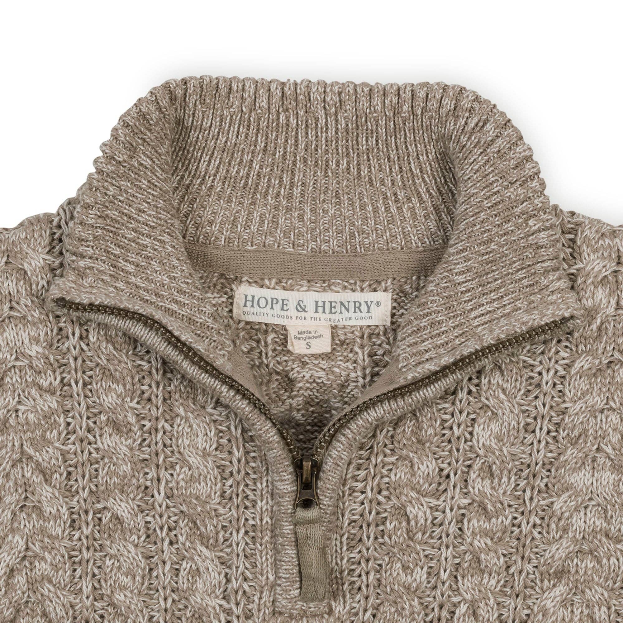 Close-up of a beige and taupe textured knit quarter-zip sweater with a ribbed mock neck collar. The brand label 'HOPE & HENRY' is visible inside the collar.