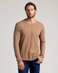Man wearing a brown long-sleeve shirt against a plain background